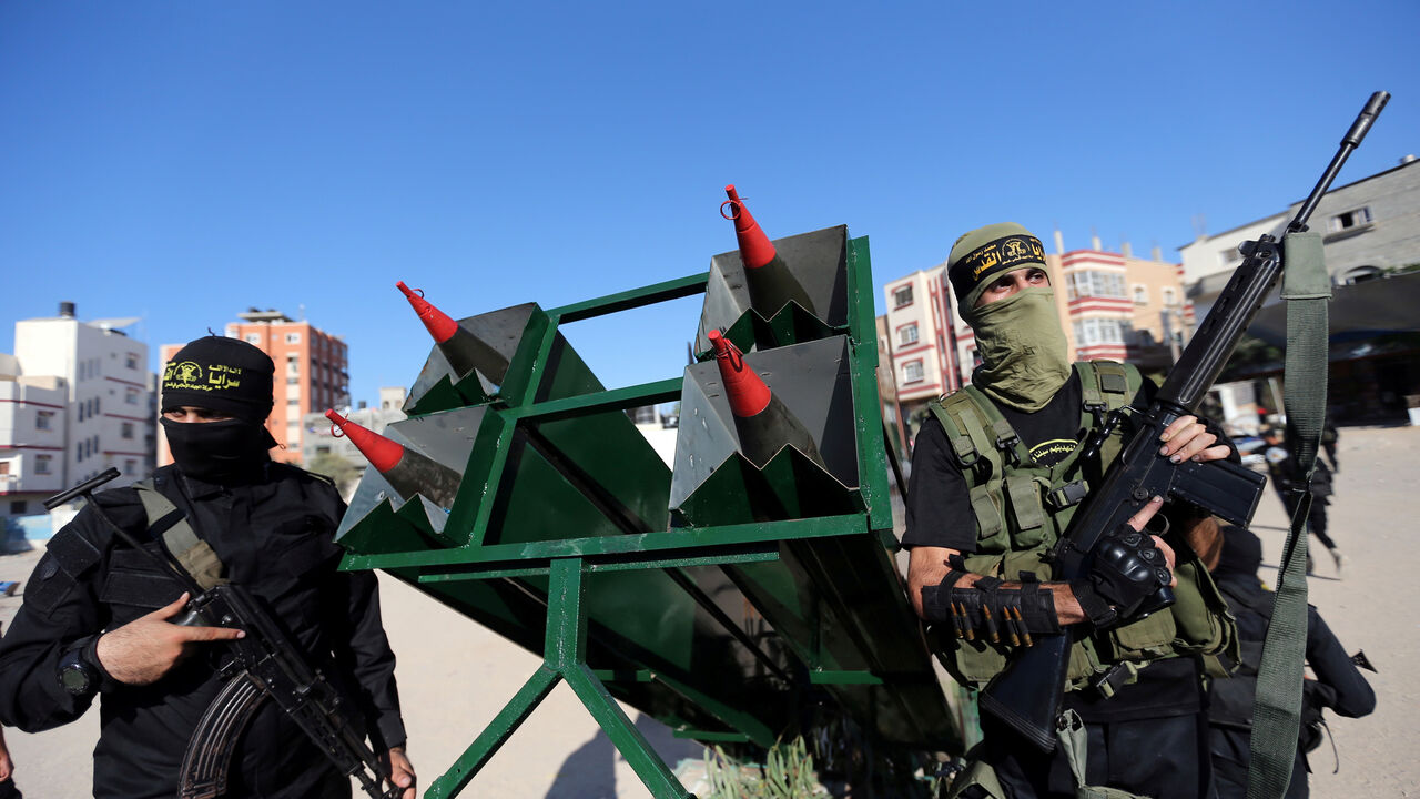 ISRAEL-PALESTINIANS/ Palestinian Islamic jihad militants display rockets during a military show marking the 32nd anniversary of the organisation's founding, in the central Gaza Strip October 3, 2019. REUTERS/Ibraheem Abu Mustafa - RC1C67FC2A80