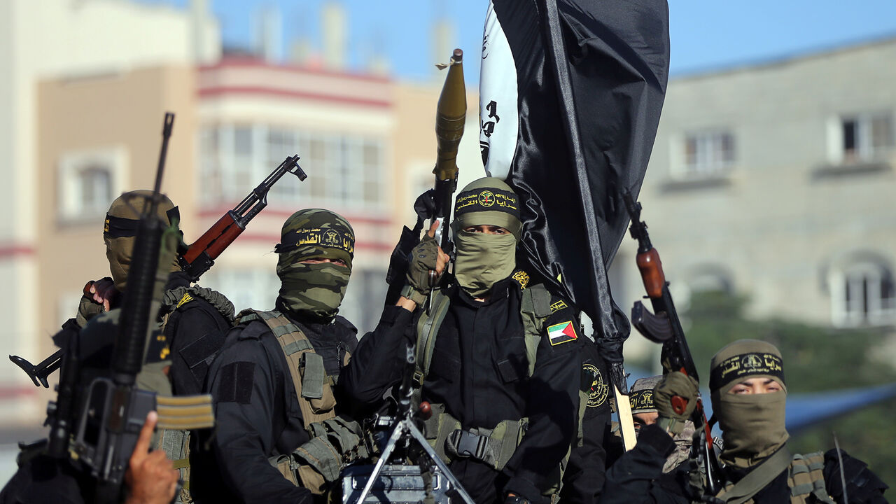 ISRAEL-PALESTINIANS/ Palestinian Islamic jihad militants take part in a military show marking the 32nd anniversary of the organisation's founding, in the central Gaza Strip October 3, 2019. REUTERS/Ibraheem Abu Mustafa - RC17E1BD1920