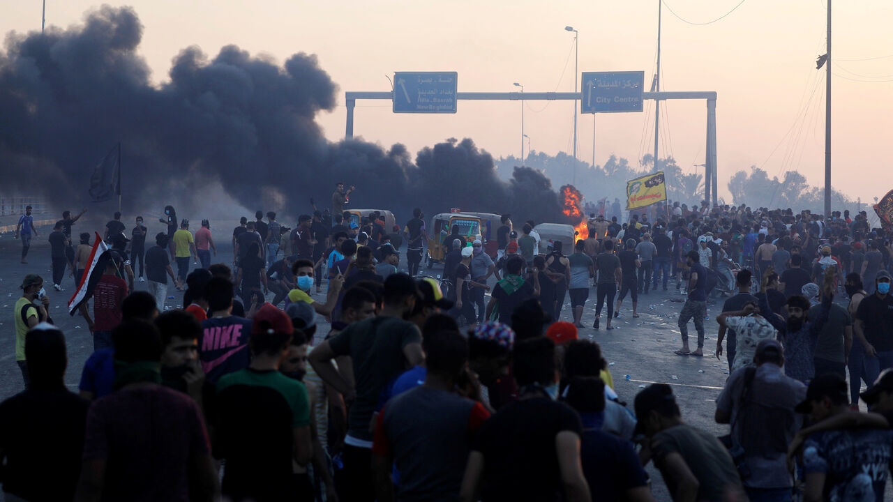 Demonstrators gather at a protest after the lifting of the curfew, following four days of nationwide anti-government protests that turned violent, in Baghdad, Iraq October 5, 2019. REUTERS/Thaier Al-Sudani - RC1144979C00