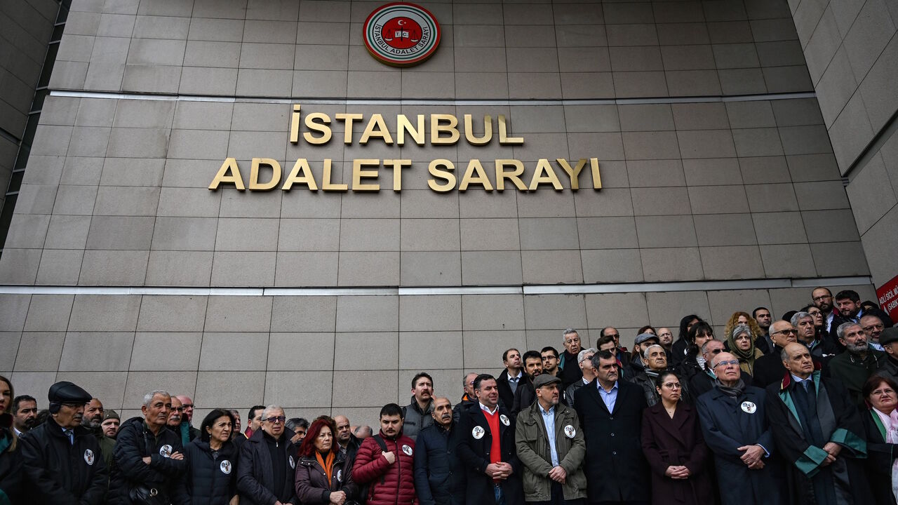 1126481005 Lawyers and opposition MP's gather outside Caglayan courthouse on February 21,2019 in Istanbul, to protest against the upholding by an appeal court of the jail sentences against opposition journalists in a long-running case targeting the Cumhuriyet newspaper. - Last year 14 former Cumhuriyet staff, including journalists and executives, were given multiple sentences for "aiding and abetting terror groups without being a member" but they remained free pending trial. An appeals court in Istanbul said it unanim