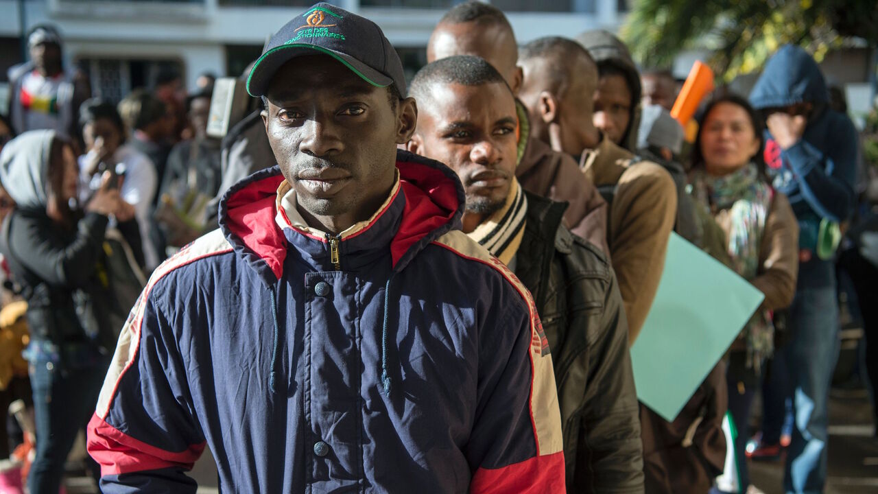 629917046 Migrants queue in line, during the second phase of a campaign to regularize illegal migrants living in Morocco, in Rabat, on December 15, 2016. / AFP / FADEL SENNA (Photo credit should read FADEL SENNA/AFP via Getty Images)