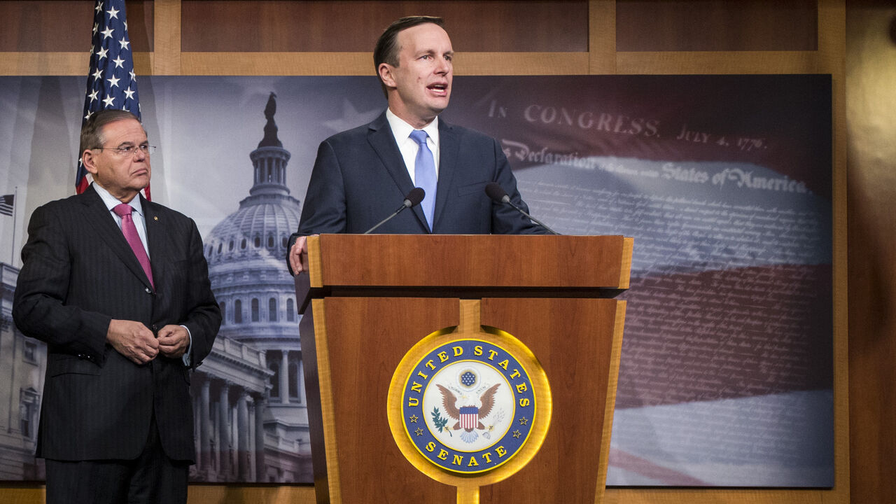 1072264986 WASHINGTON, DC - DECEMBER 12: Sen. Chris Murphy (D-CT) speaks during a news conference discussing discuss a resolution to end U.S. military support for Saudi Arabia's war with Yemen on Capitol Hill on December 12, 2018 in Washington, DC. Also pictured are Sen. Lindsey Graham (R-SC) and Sen. Bob Menendez (D-NJ). (Photo by Zach Gibson/Getty Images)