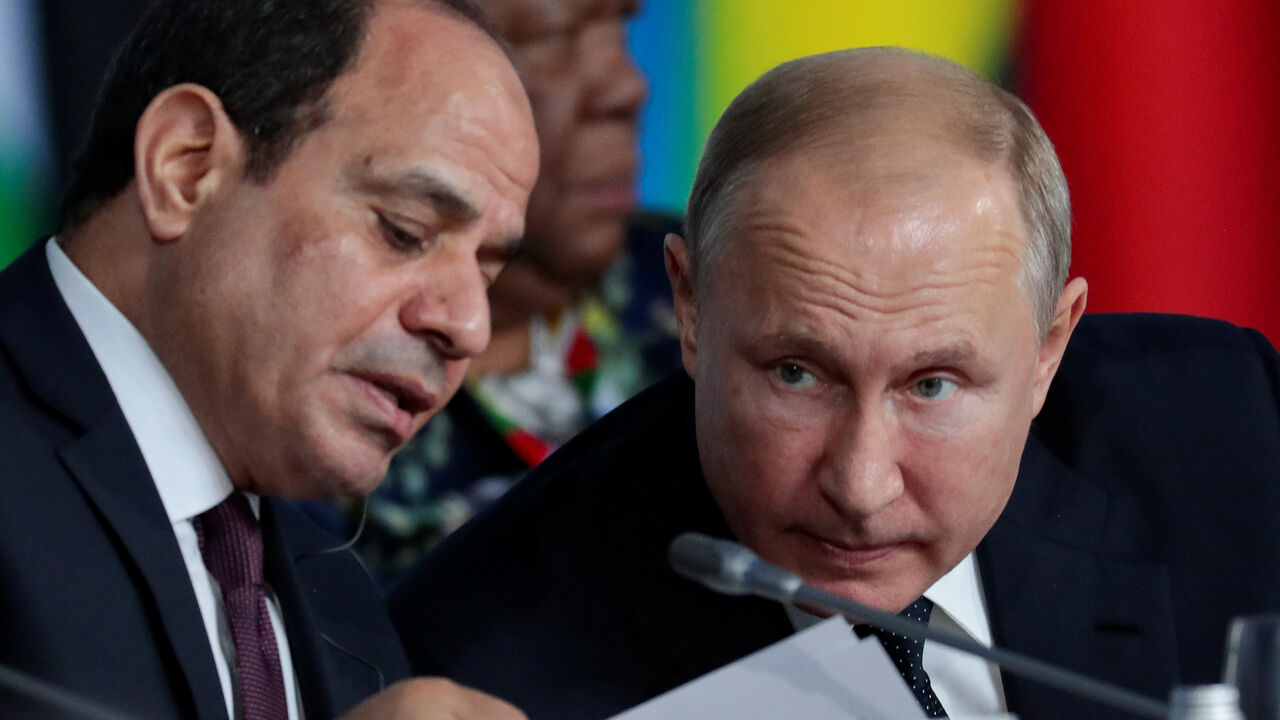 RUSSIA-AFRICA/ Egypt's President Abdel Fattah el-Sisi speaks with Russia's President Vladimir Putin during the first plenary session as part of the 2019 Russia-Africa Summit at the Sirius Park of Science and Art in Sochi, Russia, October 24, 2019. Sergei Chirikov/Pool via REUTERS - RC1AA9297200