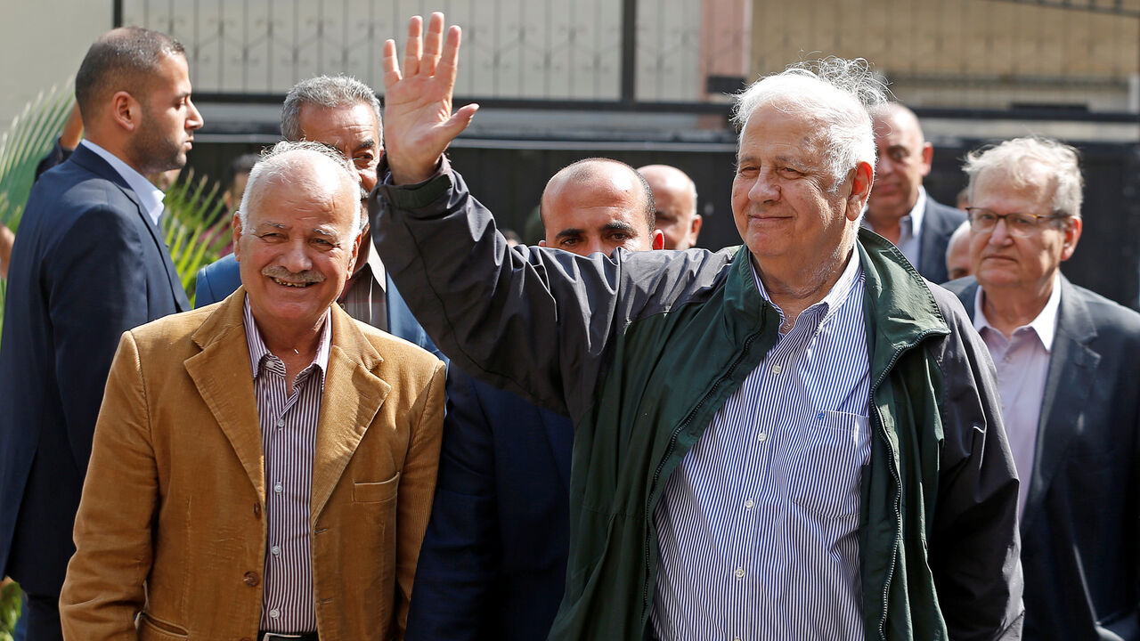 ISRAEL-PALESTINIANS/POLITICS Chairman of the Palestinian Central Election Committee Hana Naser waves after his arrival in Gaza City October 28, 2019. REUTERS/Mohammed Salem - RC1B59B02880