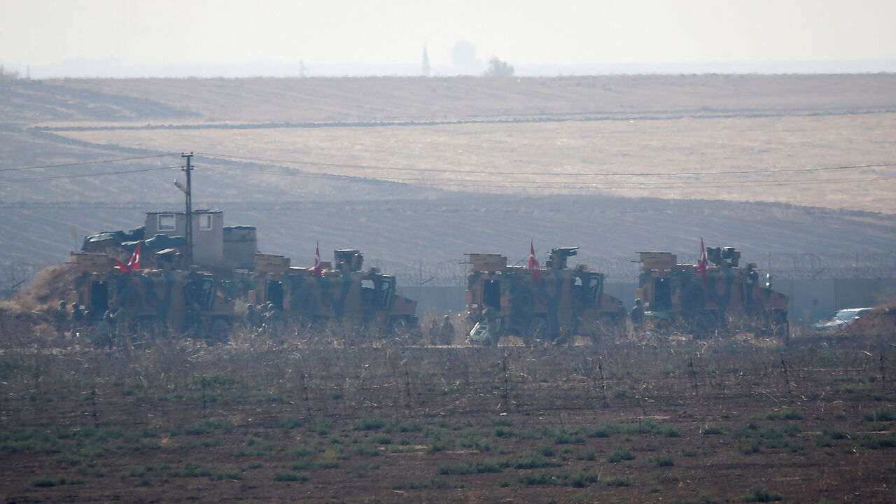 Turkish military vehicles arrive at the Turkish-Syrian border before a joint Turkish-Russian patrol in northeast Syria, near the Turkish border town of Kiziltepe Turkish military vehicles arrive at the Turkish-Syrian border before a joint Turkish-Russian patrol in northeast Syria, near the Turkish border town of Kiziltepe in Mardin province, Turkey, November 1, 2019. REUTERS/Kemal Aslan - RC188E120370