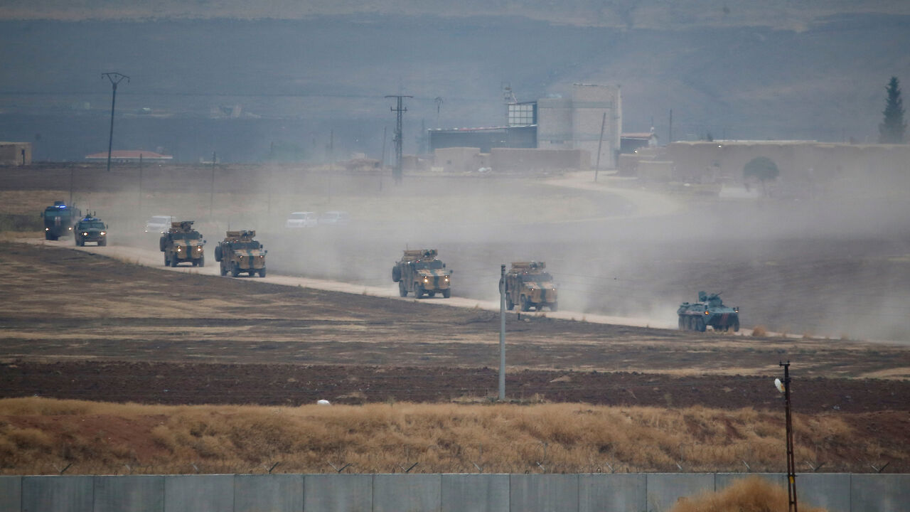 SYRIA-SECURITY/TURKEY-RUSSIA Turkish and Russian military vehicles return following a joint patrol in northeast Syria, as they are pictured from near the Turkish border town of Kiziltepe in Mardin province, Turkey, November 1, 2019. REUTERS/Kemal Aslan - RC1A4E403CD0