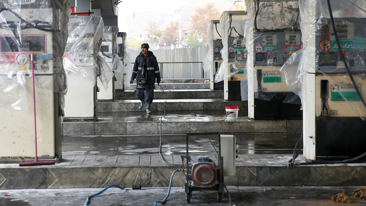 IRAN-FUEL/PROTESTS A man walks near the remains of gas pump stands, during protests against increased fuel prices, in Tehran, Iran November 20, 2019. Picture taken November 20, 2019. Nazanin Tabatabaee/WANA (West Asia News Agency) via REUTERS ATTENTION EDITORS - THIS IMAGE HAS BEEN SUPPLIED BY A THIRD PARTY - RC2CGD9I6P5F