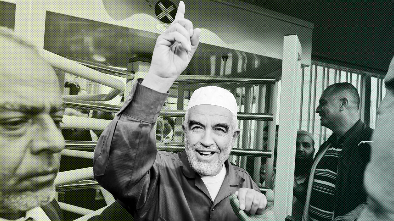 ISRAEL-PALESTINIANS/SHEIKH Leader of the northern Islamic Movement Sheikh Raed Salah gestures as he leaves the district court in Jerusalem October 27, 2015. The Arab Israeli Muslim leader, seen by Israel as a powerful voice stoking Palestinian anger over a Jerusalem holy site, was ordered jailed for 11 months on Tuesday for comments he made in 2007. Sheik Raed Salah, leader of the Islamic Movement's northern section was convicted for incitement to violence in 2013, the Justice Ministry said, charges he denied. His attorney said he wo
