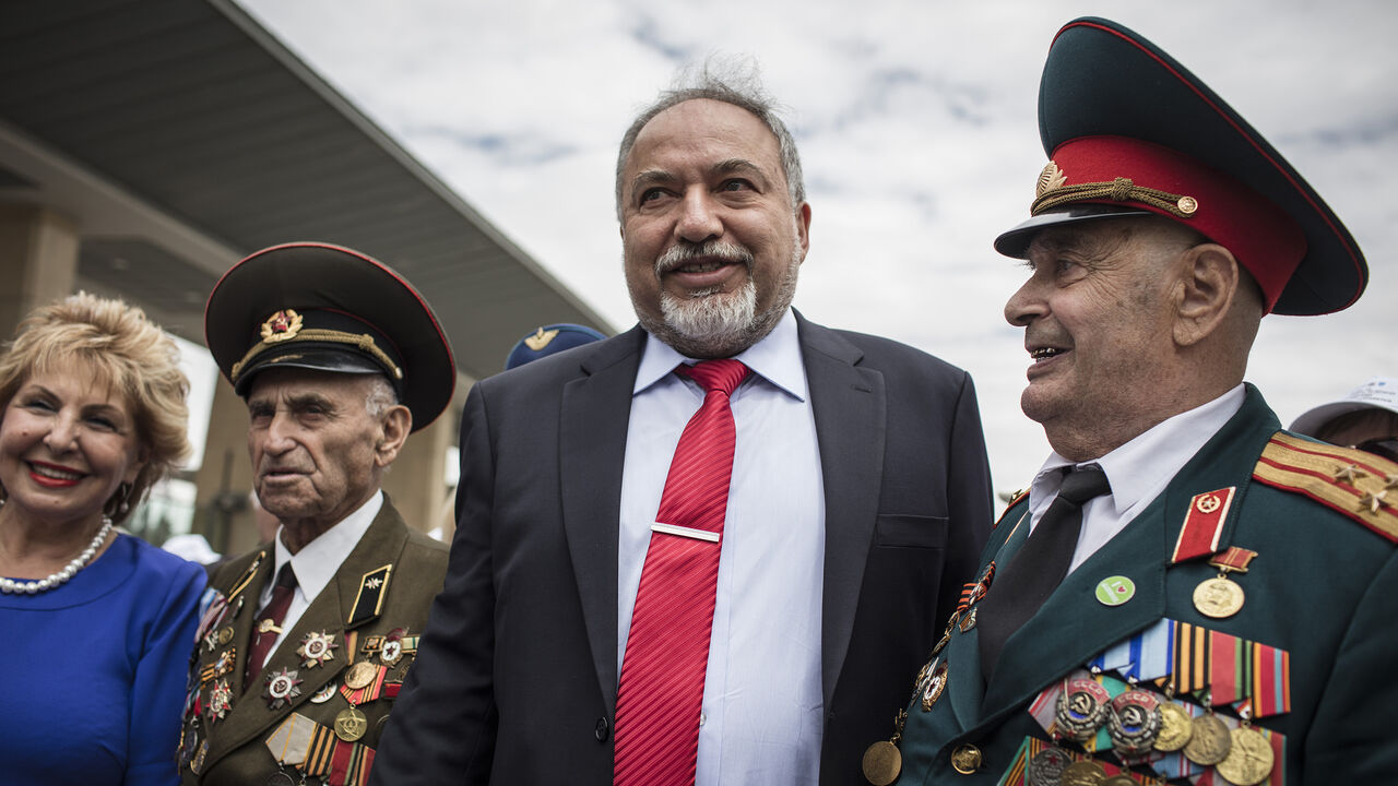 955936228 JERUSALEM, ISRAEL - MAY 08: israeli minister of defense Avigdor Liberman greeting the Veterans of the Red army celebrating and comemorating victory over Nazi Germany 73 yeras ago at the Isreali Parlament (The Knesset) on May 8, 2018 in Jerusalem, Israel. Total numbers of deaths during World War II vary but the Soviet Union bore an incredible brunt of casualties during WWII. An estimated 16,825,000 people died in the war, over 15% of its population, many of them were jewish soldiers and Partisan fighters. In