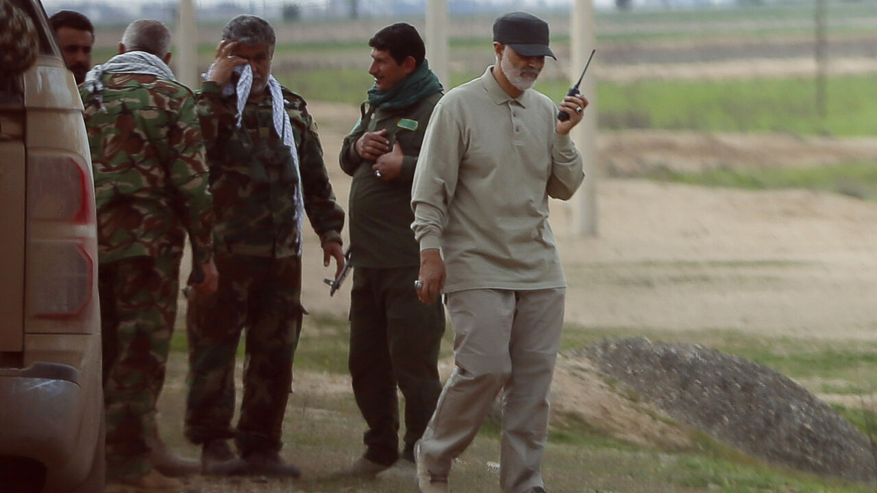 MIDEAST-CRISIS/IRAQ Iranian Revolutionary Guard Commander Qassem Soleimani uses a walkie-talkie at the frontline during offensive operations against Islamic State militants in the town of Tal Ksaiba in Salahuddin province March 8, 2015. Picture taken March 8, 2015. REUTERS/Stringer (IRAQ - Tags: CIVIL UNREST CONFLICT POLITICS) - GM1EB3I1GO301