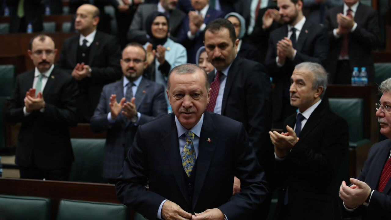 MIDEAST-CRISIS/SYRIA-TURKEY-USA Turkish President Tayyip Erdogan leaves his seat to address members of parliament from his ruling AK Party (AKP) during a meeting at the Turkish parliament in Ankara, Turkey, January 15, 2019. REUTERS/Umit Bektas - RC177363CD90