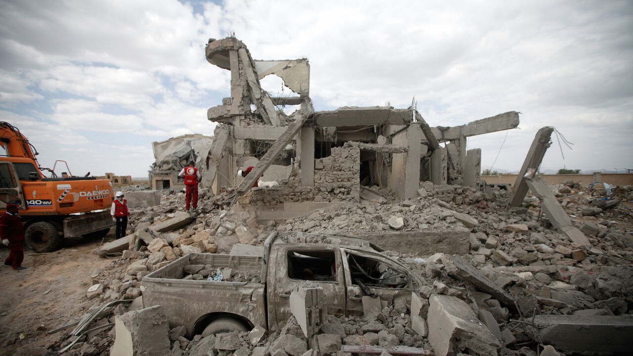 YEMEN-SECURITY/DHAMAR Destroyed car is seen between rubble as Red Crescent medics inspect the site of Saudi-led air strikes on a Houthi detention centre in Dhamar, Yemen, September 1, 2019. REUTERS/Mohamed al-Sayaghi - RC15DB729000