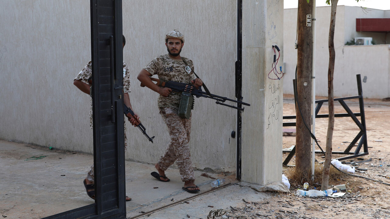 LIBYA-SECURITY/ Members of Libya's internationally recognized government forces carry weapons in Ain Zara, Tripoli, Libya October 14, 2019. Picture taken October 14, 2019. REUTERS/Ismail Zitouny - RC1F8CC25910