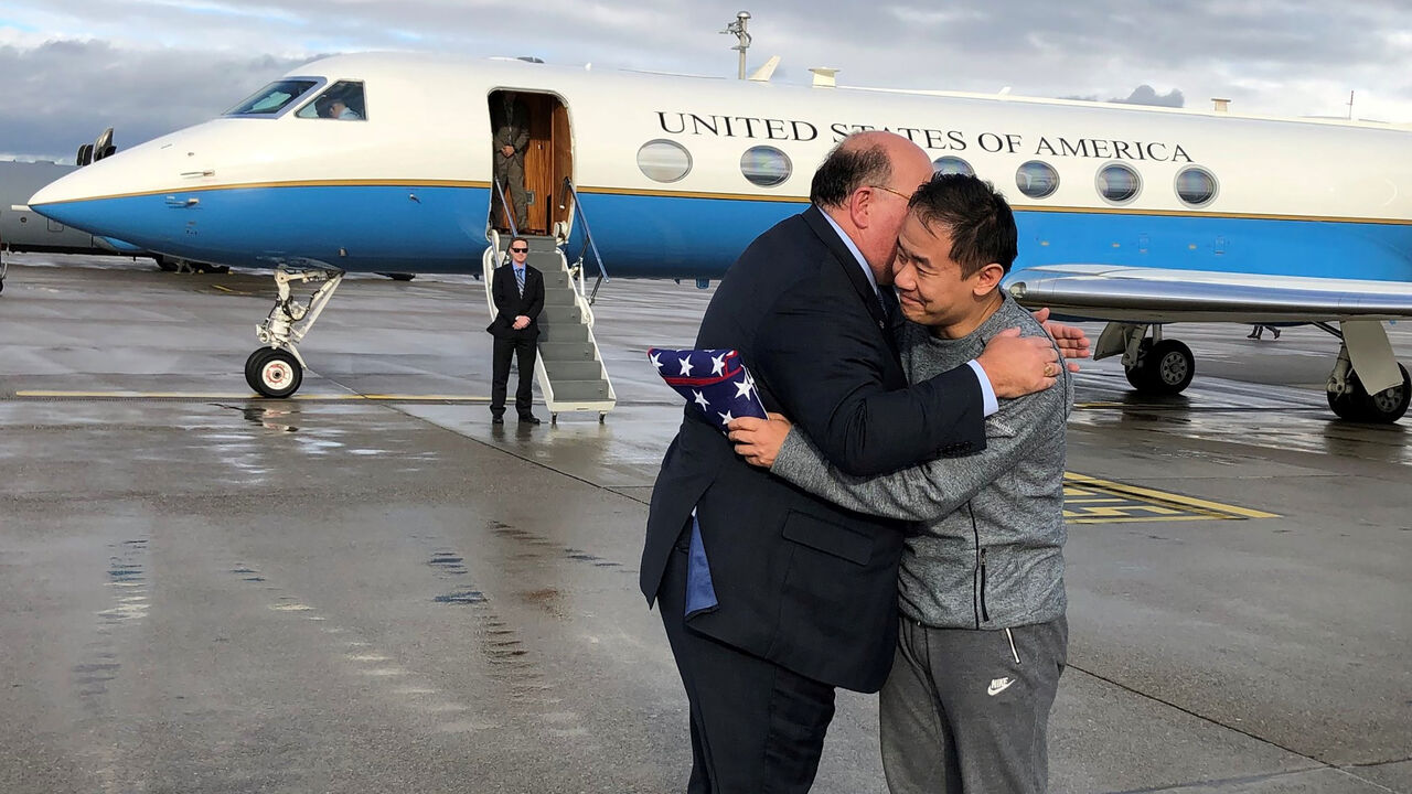 IRAN-USA/PRISONERS U.S. Ambassador to Switzerland Edward McMullen greets Xiyue Wang in Zurich, Switzerland December 7, 2019. U.S. Embassy in Switzerland/Handout via REUTERS ATTENTION EDITORS - THIS IMAGE WAS PROVIDED BY A THIRD PARTY - RC2GQD9FJJ4H