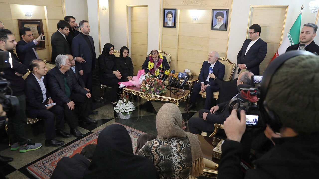 IRAN-USA/PRISONERS Iranian professor Massoud Soleimani is seen next to Iran's Foreign Minister Mohammad Javad Zarif during his arrival at Mehrabad airport, in Tehran, Iran December 7, 2019. Picture taken December 7, 2019. West Asia News Agency (WANA) via REUTERS ATTENTION EDITORS - THIS IMAGE HAS BEEN SUPPLIED BY A THIRD PARTY - RC2VQD9YNUU9