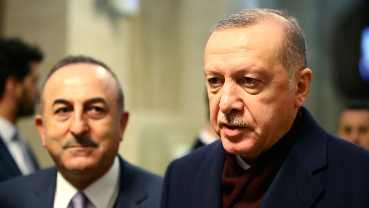 UN-REFUGEES/ Turkey's President Recep Tayyip Erdogan speaks to media next to Foreign Minister Mevlut Cavusoglu after the Global Refugee Forum at the United Nations in Geneva, Switzerland, December 17, 2019, REUTERS/Denis Balibouse - RC24XD92W2GU