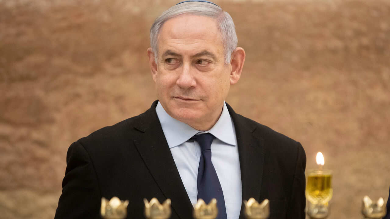 ISRAEL-POLITICS/NETANYAHU Israeli Prime Minister Benjamin Netanyahu looks on after lighting a Hanukkah candle at the Western Wall, the holiest site where Jews can pray in Jerusalem's old city, December 22, 2019. Sebastian Scheiner/Pool via REUTERS - RC2I0E9GDB8Y