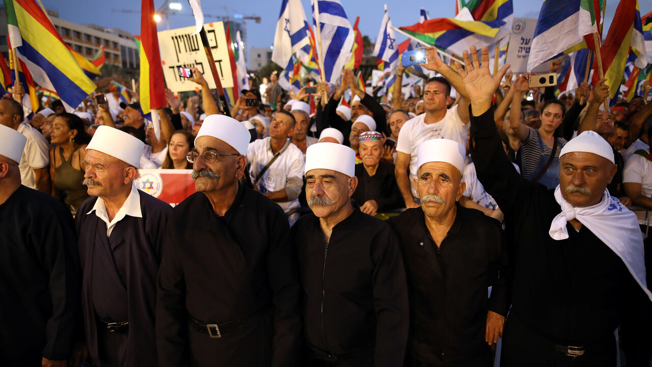 ISRAEL-POLITICS/LAW-PROTEST Leaders from the Druze minority together with others take part in a rally to protest against Jewish nation-state law in Rabin square in Tel Aviv, Israel, August 4, 2018. REUTERS/Corinna Kern - RC1149638BE0