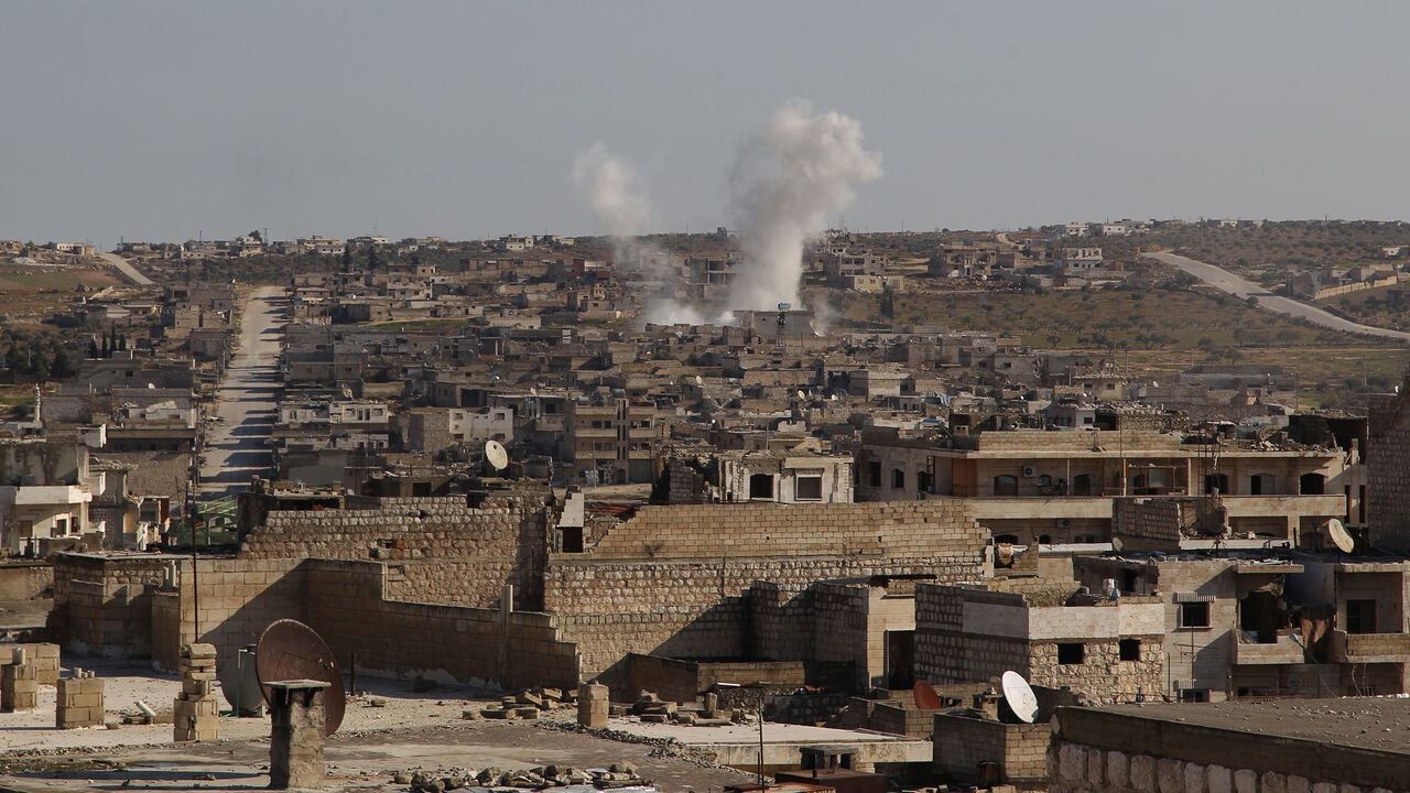 1193447233 Smoke billows following a reported air strike by pro-regime forces in the town of Maaret Al-Numan in Syria's northwestern Idlib province on January 13, 2020. (Photo by Abdulaziz KETAZ / AFP) (Photo by ABDULAZIZ KETAZ/AFP via Getty Images)