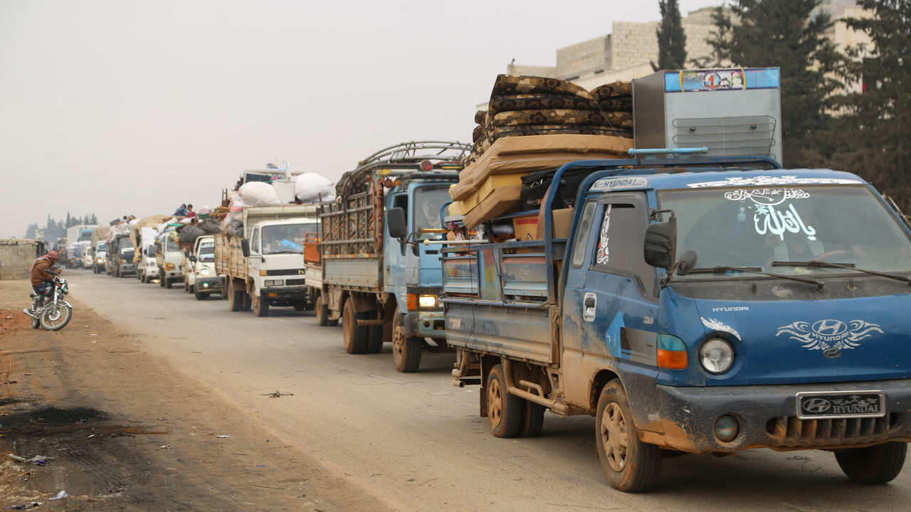 SYRIA-SECURITY/DISPLACED Trucks carry belongings of people fleeing from Maarat al-Numan, in northern Idlib, Syria December 24, 2019. REUTERS/Mahmoud Hassano - RC2U1E9W99L0