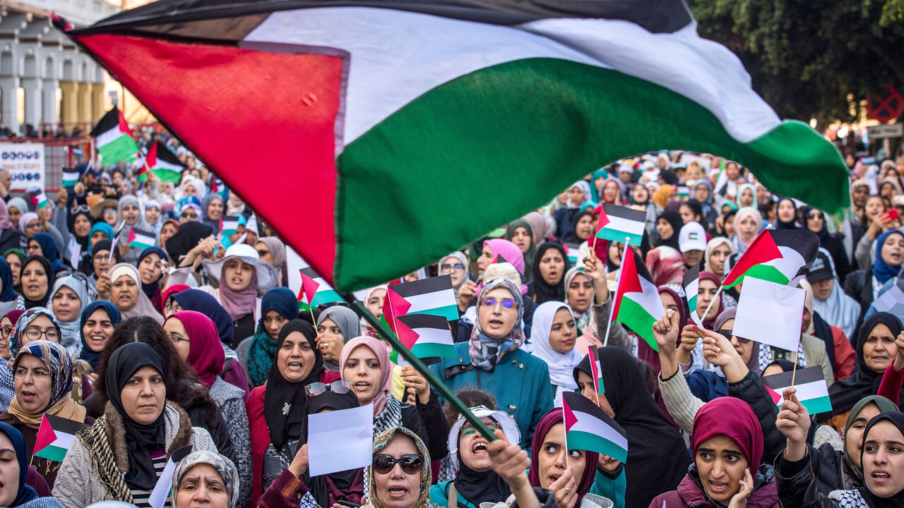 1199625864 Moroccans wave the Palestinian flag during a demonstration against the US Middle East peace plan in the capital Rabat on February 9, 2020. - Morocco has warming but quiet relations with Israel, although they do not enjoy formal diplomatic ties. Israel and Morocco opened "liaison" offices in each other's countries in the mid-1990s but Rabat closed them after an escalation of Palestinian-Israeli violence in 2000. (Photo by FADEL SENNA / AFP) (Photo by FADEL SENNA/AFP via Getty Images)