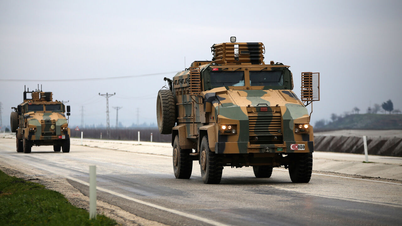 1200227497 HATAY, TURKEY - FEBRUARY 12: A convoy of Turkish Armed Forces, including Armoured Personnel Carrier (APC) vehicles carrying commandos, pass through Hatay province of Turkey to support the border units on February 12, 2020. (Photo by Eren Bozkurt/Anadolu Agency via Getty Images)