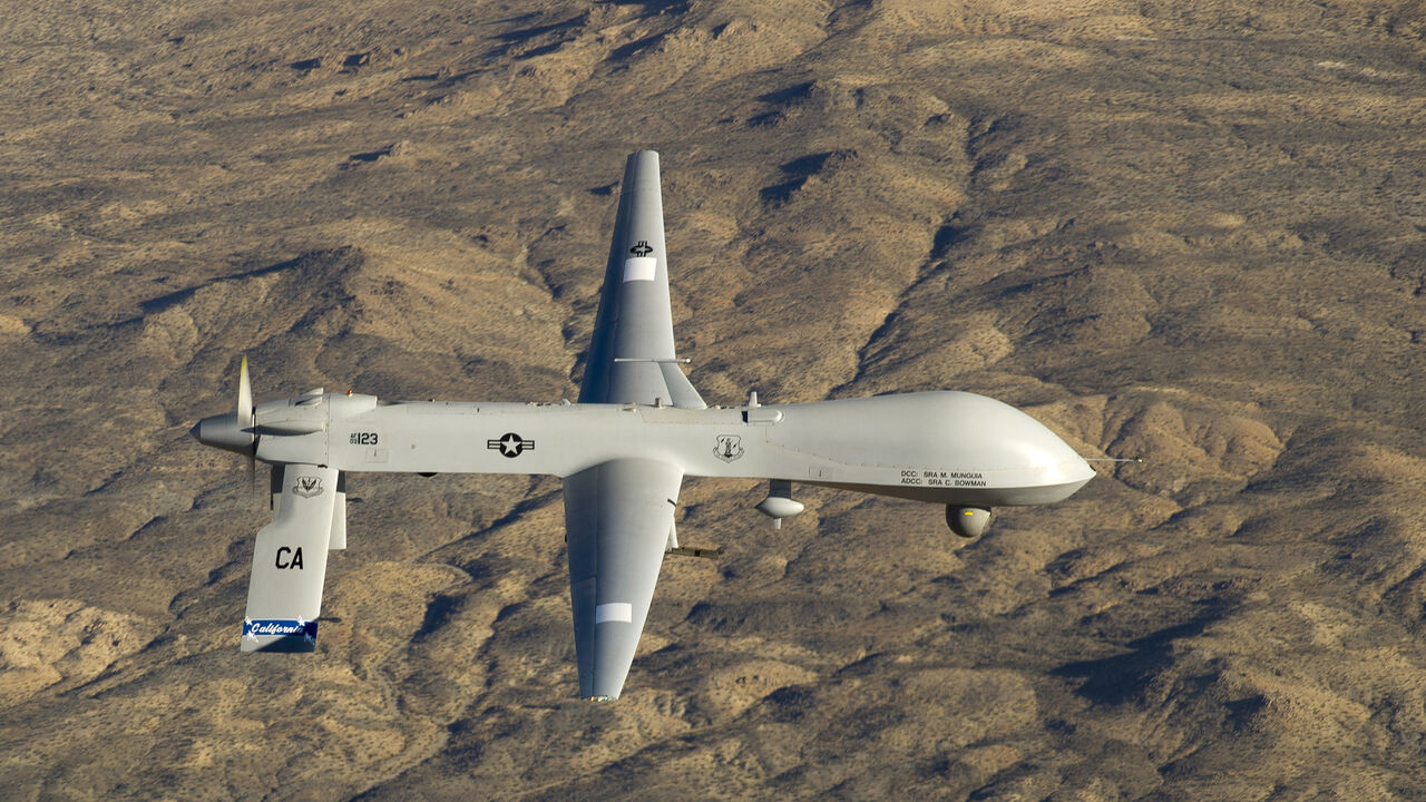 USA-DRONES/ A U.S. Air Force MQ-1 Predator unmanned aerial vehicle assigned to the California Air National Guard's 163rd Reconnaissance Wing flies near the Southern California Logistics Airport in Victorville, California in this January 7, 2012 USAF handout photo obtained by Reuters February 6, 2013. REUTERS/U.S. Air Force/Tech. Sgt. Effrain Lopez/Handout (UNITED STATES - Tags: MILITARY POLITICS) THIS IMAGE HAS BEEN SUPPLIED BY A THIRD PARTY. IT IS DISTRIBUTED, EXACTLY AS RECEIVED BY REUTERS, AS A SERVICE TO CLI