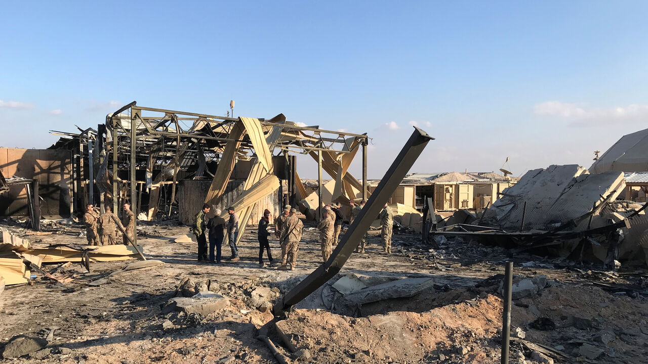 IRAQ-SECURITY/ U.S. soldiers inspect the site where an Iranian missile hit at Ain al-Asad air base in Anbar province, Iraq January 13, 2020. REUTERS/John Davison - RC23FE9R37HE