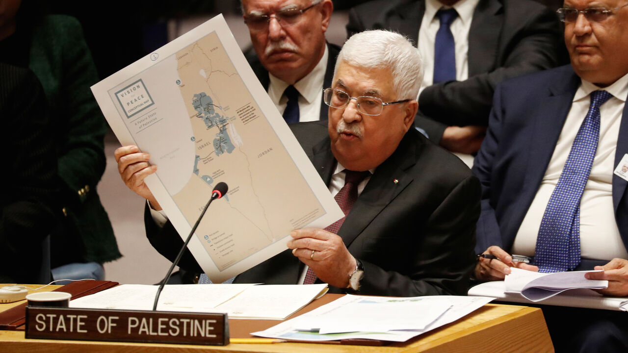 ISRAEL-PALESTINIANS/UN Palestinian President Mahmoud Abbas holds a map while speaking during a Security Council meeting at the United Nations in New York, U.S., February 11, 2020. REUTERS/Shannon Stapleton - RC2FYE9OX8R2