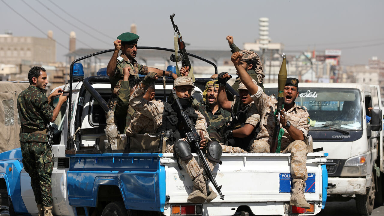 YEMEN-SECURITY/ Houthi troops ride on the back of a police patrol truck after participating in a Houthi gathering in Sanaa, Yemen February 19, 2020. REUTERS/Khaled Abdullah - RC2M3F9S75BB