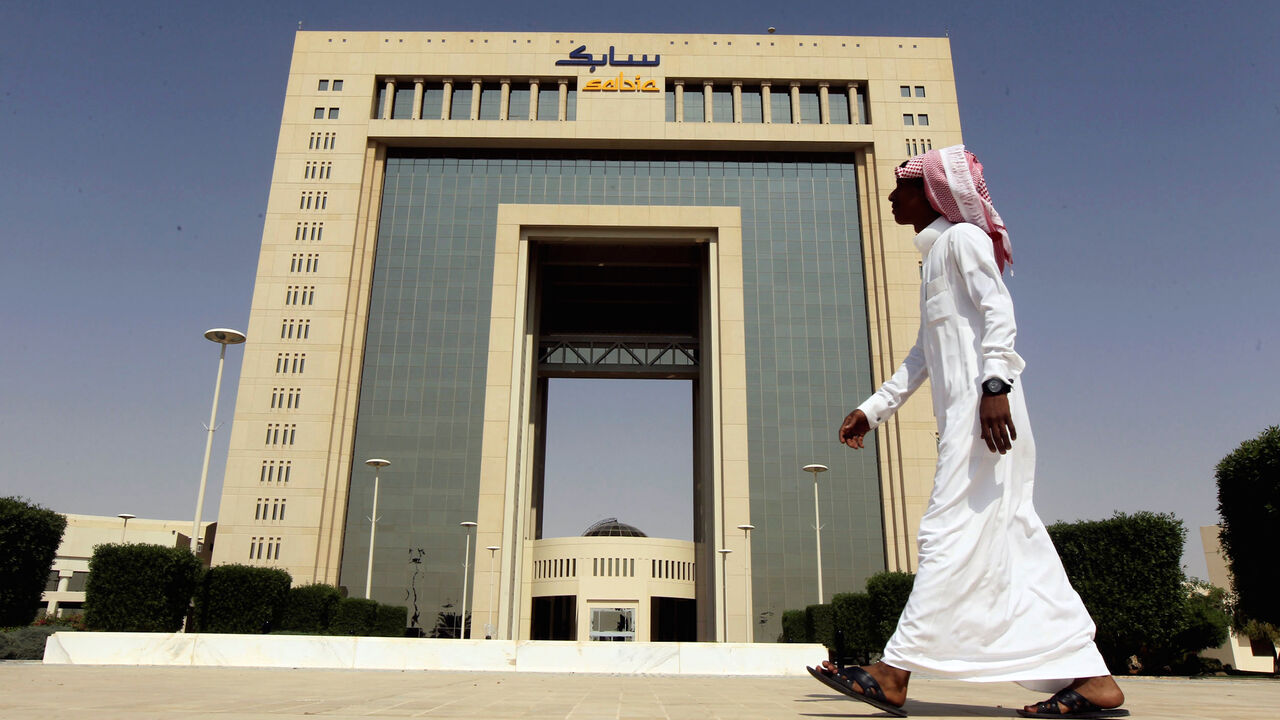 SAUDI-EARNINGS/ A man walks past the headquarters of Saudi Basic Industries Corp (SABIC) in Riyadh, Saudi Arabia October 27, 2013. REUTERS/Faisal Al Nasser/File Photo TPX IMAGES OF THE DAY - S1BETCCGREAA