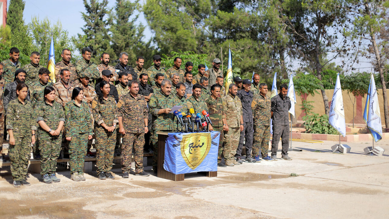 MIDEAST-CRISIS/SYRIA-MANBIJ The Manbij Military Council members are seen during a news conference in Manbij, Syria June 6, 2018. REUTERS/Rodi Said - RC119372D1F0