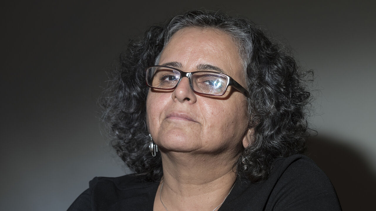 1026536228 BRUSSELS, BELGIUM - AUGUST 3: Arab feminist group Women Against Violence founder Aida Touma-Suleiman listens during a conference organised by Abp Asbl (Association belgo palestinienne) on September 3, 2018 in Brussels, Belgium. The Knesset is the unicameral parliament of the State of Israel in Jerusalem where members are elected for a four-year term. Since its creation in 1949, of the 19 elected chambers, 12 have been dissolved. In the 2015 parliamentary elections, of the 120 seats in the 20th Knesset, 13