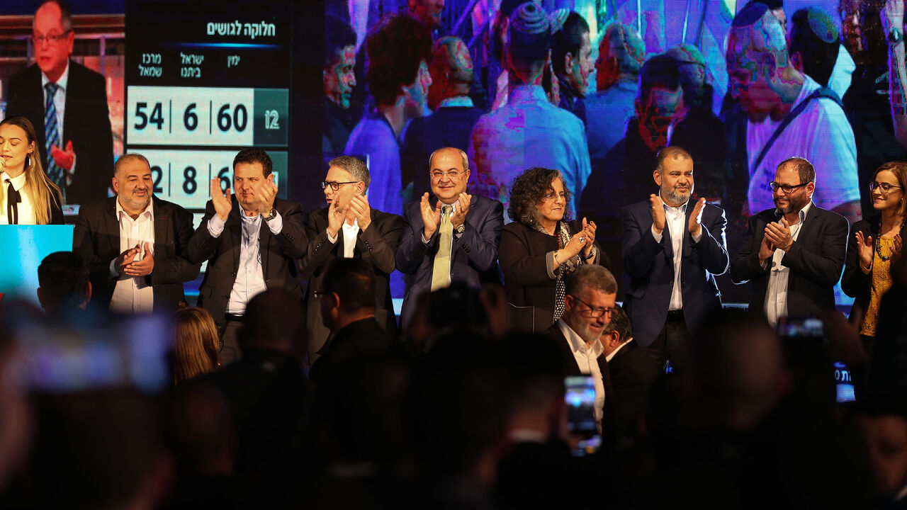 1204820834 SHEFA AMR, ISRAEL - MARCH 3: Head of the Joint List Ayman Odeh (2nd L), the members Heba Yazbak (R), Mansour Abbas (L), Mtanes Shehadeh (3rd L), Aida Touma (4th R), Ahmed Tibi (4th L) and Ofer Cassif (2nd R) attend a program in Israel's northern city of Shefa-Amr on March 2, 2020, after polls officially closed in Israeli general elections. (Photo by Mostafa Alkharouf/Anadolu Agency via Getty Images)