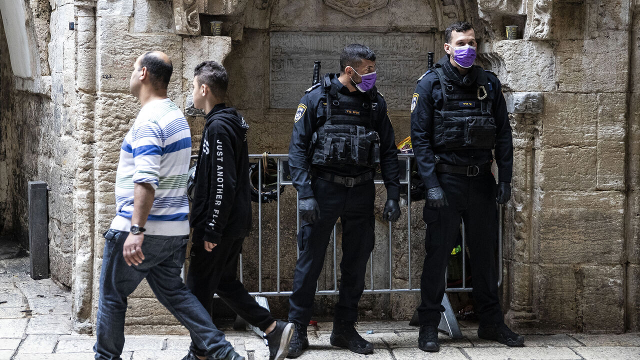 JERUSALEM - MARCH 15: Muslims perform prayer outside the Al-Aqsa Mosque after the Islamic Waqf Department announced to close the enclosed prayer places as a precautionary measure to prevent the spread of the coronavirus (COVID-19) outbreak in Jerusalem on March 15, 2020. According to the statement, all prayers remain to be held in the [outdoor] courtyard and all doors will be open to worshipers. (Photo by Mostafa Alkharouf/Anadolu Agency via Getty Images)