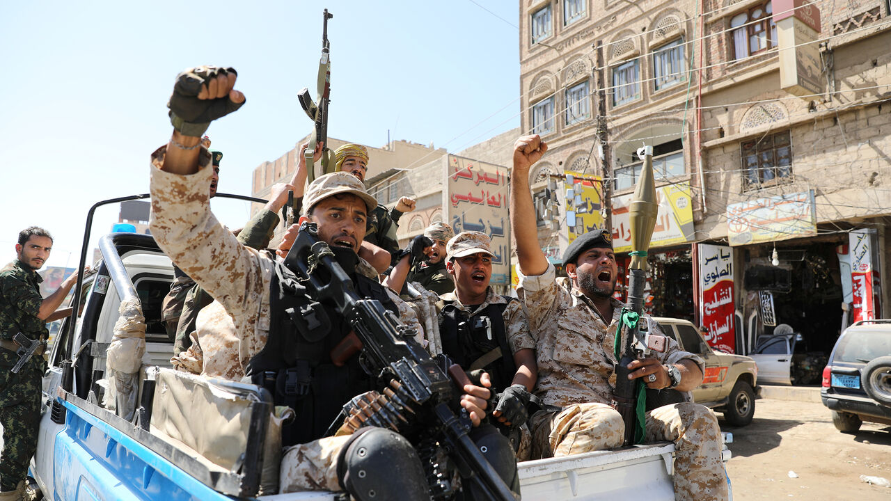 YEMEN-SECURITY/ Houthi troops ride on the back of a police patrol truck after participating in a Houthi gathering in Sanaa, Yemen February 19, 2020. REUTERS/Khaled Abdullah - RC2M3F90W6HV
