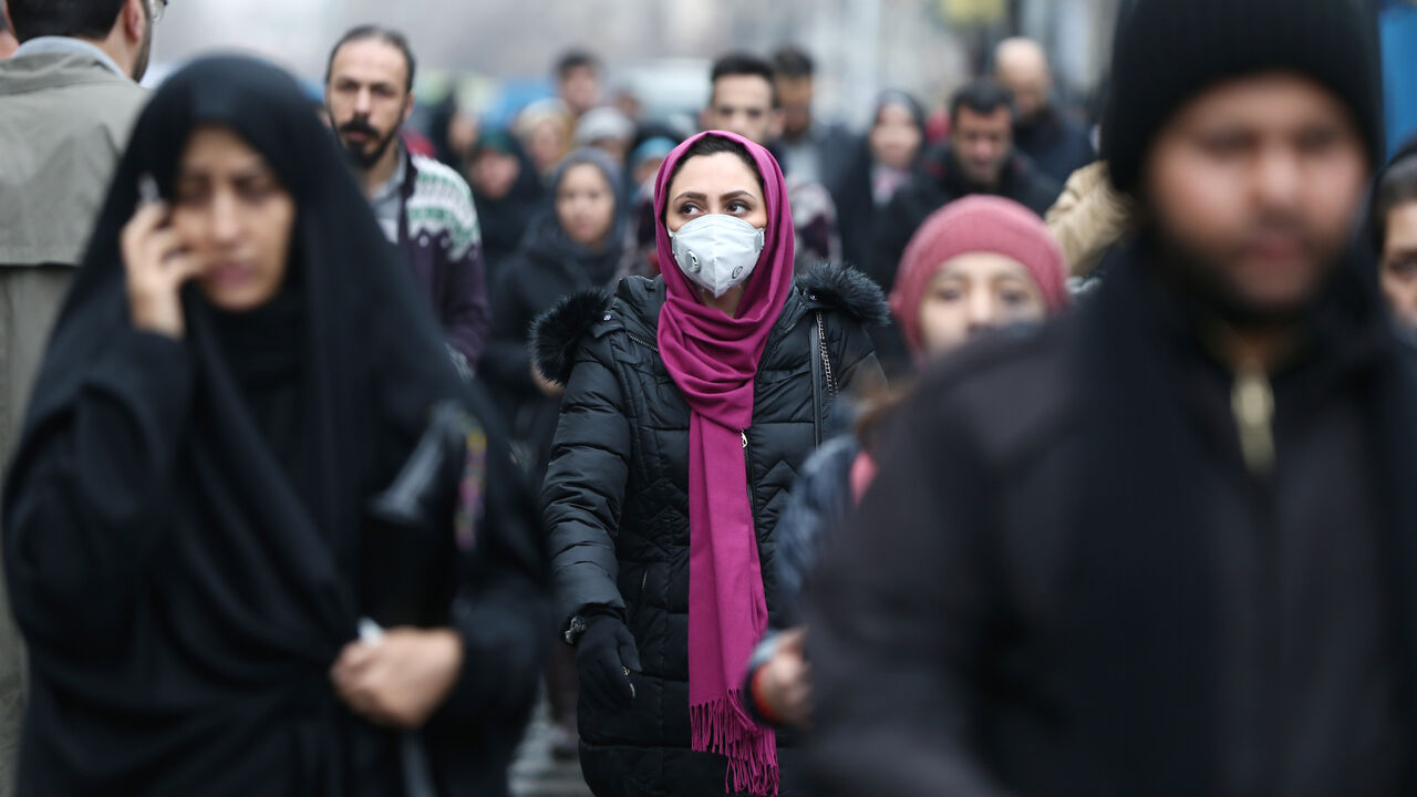 CHINA-HEALTH/IRAN An Iranian woman wearing a protective mask to prevent contracting a coronavirus walks at Grand Bazaar in Tehran, Iran February 20, 2020. WANA (West Asia News Agency)/Nazanin Tabatabaee via REUTERS ATTENTION EDITORS - THIS IMAGE HAS BEEN SUPPLIED BY A THIRD PARTY. - RC2D4F92XR0E