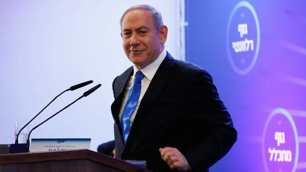 ISRAEL-POLITICS/NETANYAHU Israeli Prime Minister Benjamin Netanyahu smiles as he speaks at a regional council chairpersons' conference in Kiryat Anavim, Israel February 26, 2020. REUTERS/Ronen Zvulun - RC2A8F9CFKN0