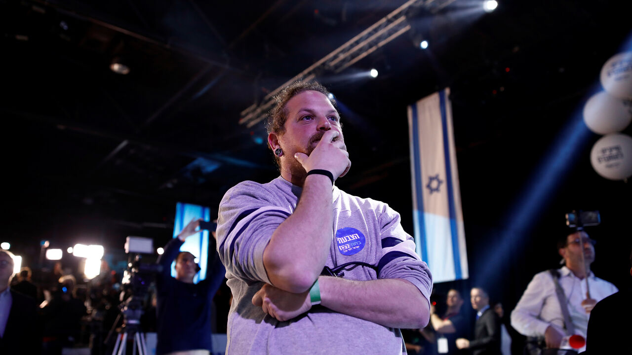 ISRAEL-ELECTION/BLUE&WHITE HEADQUARTERS A supporter reacts as results of the exit polls are shown at Benny Gantz's Blue and White party headquarters, following Israel's national election, in Tel Aviv, Israel March 2, 2020. REUTERS/Corinna Kern - RC2WBF9A844E