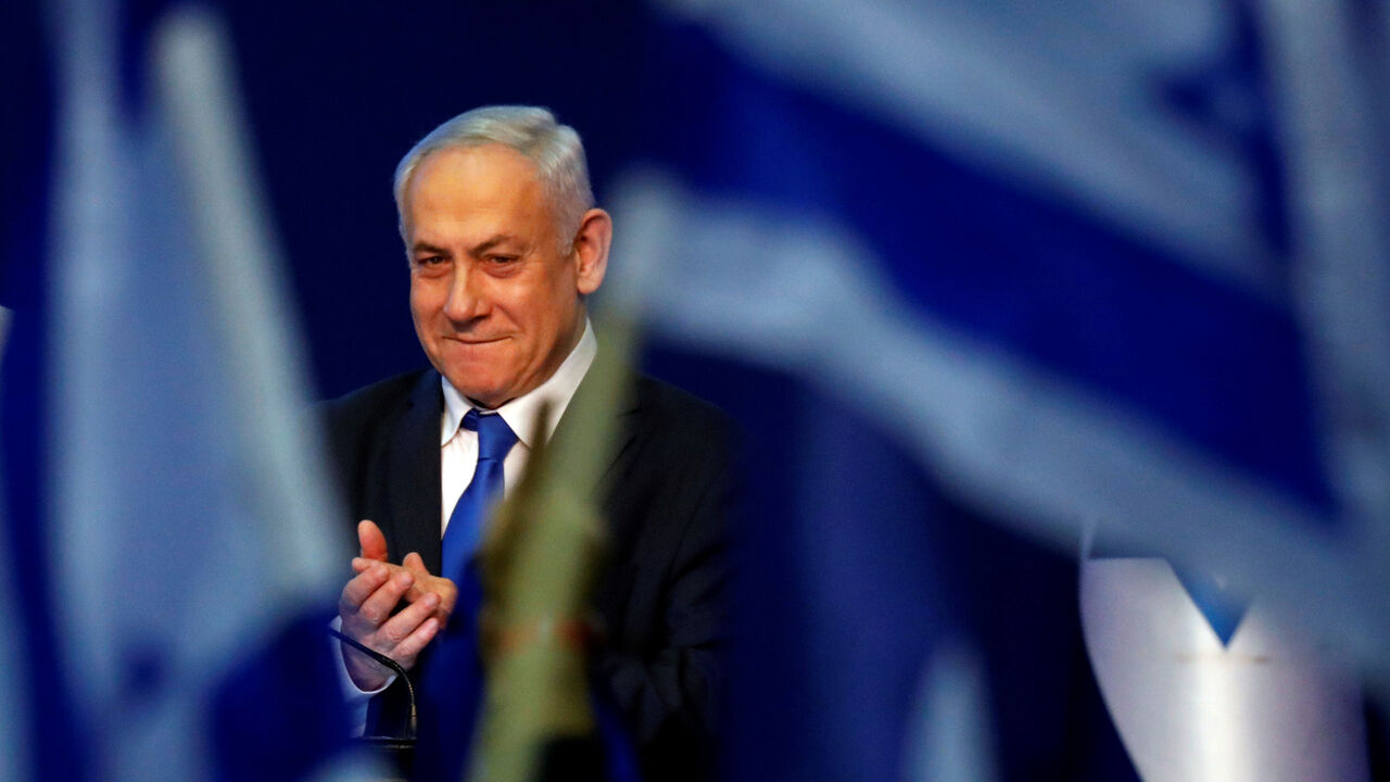ISRAEL-ELECTION/LIKUD HEADQUARTERS Israeli Prime Minister Benjamin Netanyahu reacts upon his arrival to address his supporters following the announcement of exit polls in Israel's election at his Likud party headquarters in Tel Aviv, Israel March 3, 2020. REUTERS/Amir Cohen - RC20CF9CV5B1