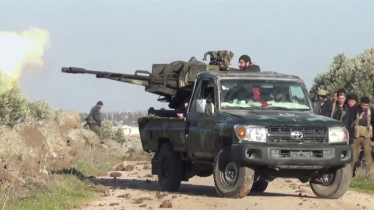 SYRIA-SECURITY/IDLIB A still image taken from a video obtained by Reuters and shot on March 2, 2020, shows Syrian army soldiers firing a weapon as they advance on the town of Kfar Nabl, Syria. Reuters TV/via REUTERS - RC2DCF9FHZKZ