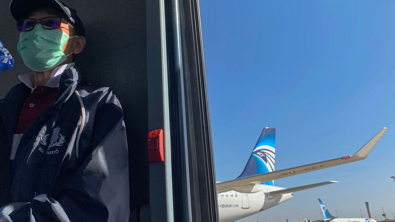 HEALTH-CORONAVIRUS/EGYPT A passenger wears a protective mask at Cairo International Airport, following the outbreak of the coronavirus disease (COVID-19), in Cairo, Egypt March 10, 2020. REUTERS/Mohamed Abd El Ghany - RC2ZGF9LL3SF