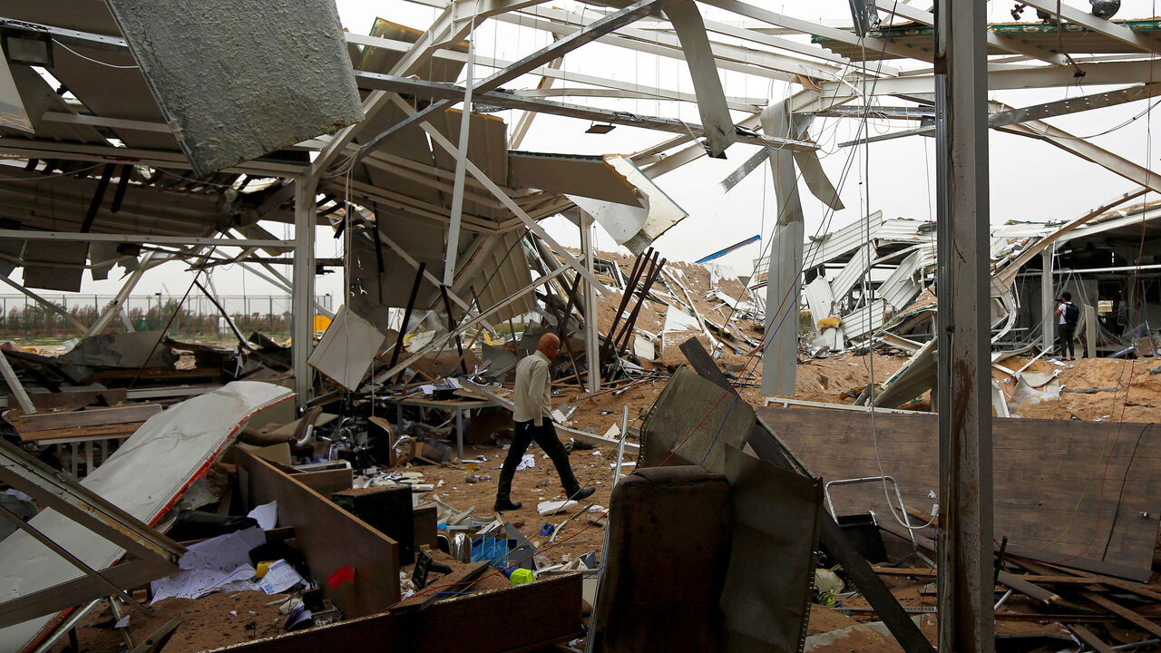 IRAQ-SECURITY/USA-IRAN-RETALIATION-AIRPORT A worker checks the damages at a civilian airport under construction which, according to Iraqi religious authorities, was hit by a U.S. air strike, in the holy Shi'ite city of Kerbala, Iraq March 13, 2020. REUTERS/Alaa al-Marjani TPX IMAGES OF THE DAY - RC2ZIF9V7W4S