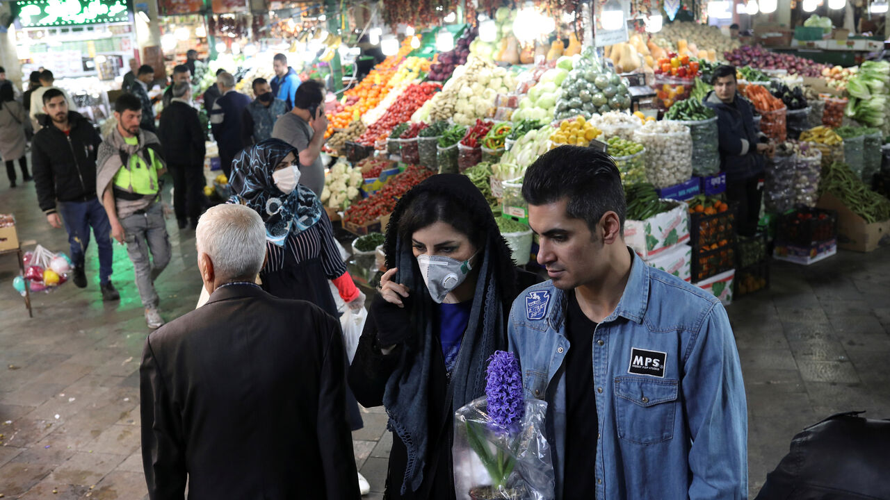 HEALTH-CORONAVIRUS/IRAN-NOWRUZ An Iranian woman wears a protective face mask, amid fear of coronavirus disease (COVID-19), as she shops at Tajrish Bazar, ahead of the Iranian New Year Nowruz, March 20, in Tehran, Iran March 18, 2020. Picture taken March 18, 2020. WANA (West Asia News Agency)/Ali Khara via REUTERS ATTENTION EDITORS - THIS PICTURE WAS PROVIDED BY A THIRD PARTY - RC22NF96FTGC