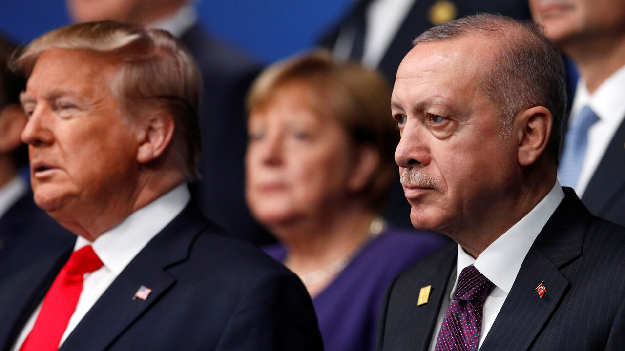 U.S. President Donald Trump and Turkey's President Tayyip Erdogan pose for a family photo during the annual NATO heads of government summit at the Grove Hotel in Watford, Britain December 4, 2019.  REUTERS/Peter Nicholls/Pool - RC2COD9N7WI1