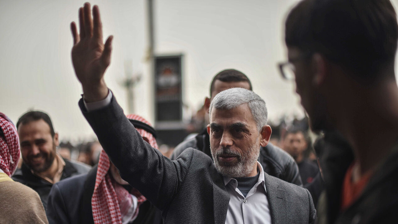 1133730442 KHAN YUNIS, GAZA - MARCH 30: Leader of Hamas in the Gaza Strip Yahya Sinwar greets Palestinians during a protest within the "Great March of Return" and "Palestinian Land Day" demonstrations at Israel-Gaza border in Khan Yunis, Gaza on March 30, 2019. (Photo by Abed Zagout/Anadolu Agency/Getty Images)