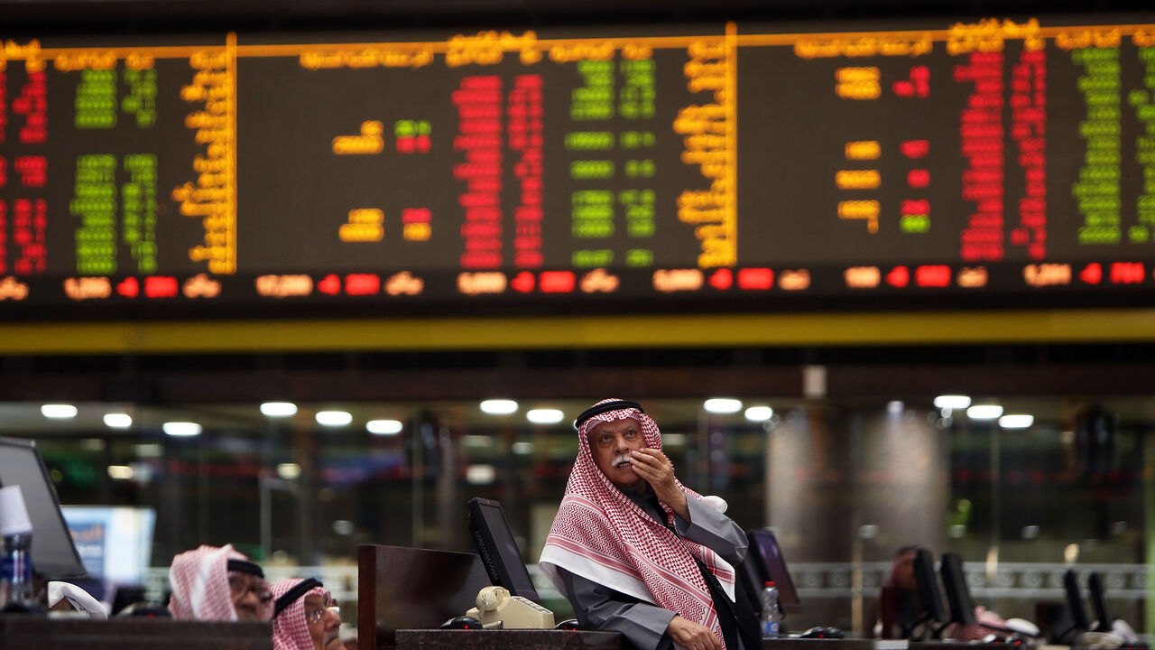 1192030627 Kuwaiti traders follow stock prices at Boursa Kuwait stock market, in Kuwait City on January 6, 2020. - Gulf stock markets were hit by a panicky sell-off amid Iranian vows of retaliation over the US killing of top military commander Qasem Soleimani, with all seven markets in the Gulf Cooperation Council (GCC) states closing in the red on the first trading day since the US attack. (Photo by YASSER AL-ZAYYAT / AFP) (Photo by YASSER AL-ZAYYAT/AFP via Getty Images)
