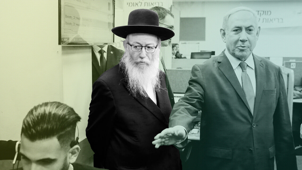 1204324183 Israeli Prime Minister Benjamin Netanyahu delivers a speech, alongside Israeli Health Minister Yaakov Litzman (C), during a visit to the Corona virus outbreak central response unit at Israeli Ministry of Health in the Israeli city of Kiryat Malakhi on March 1, 2020. (Photo by GIL COHEN-MAGEN / AFP) (Photo by GIL COHEN-MAGEN/AFP via Getty Images)