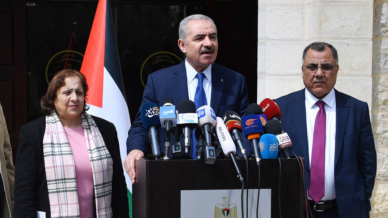 1207226795 RAMALLAH, WEST BANK - MARCH 15: (----EDITORIAL USE ONLY â MANDATORY CREDIT - "PALESTINIAN PRIME MINISTRY / HANDOUT" - NO MARKETING NO ADVERTISING CAMPAIGNS - DISTRIBUTED AS A SERVICE TO CLIENTS----) Palestinian Prime Minister Mohammad Shtayyeh (C) and Palestinian Health Minister Mai Al-Kaileh (L) hold a press conference regarding measures taken against coronavirus (COVID-19), on March 15, 2020 in Ramallah, West Bank. (Photo by Palestinian Prime Ministry / Handout/Anadolu Agency via Getty Images)