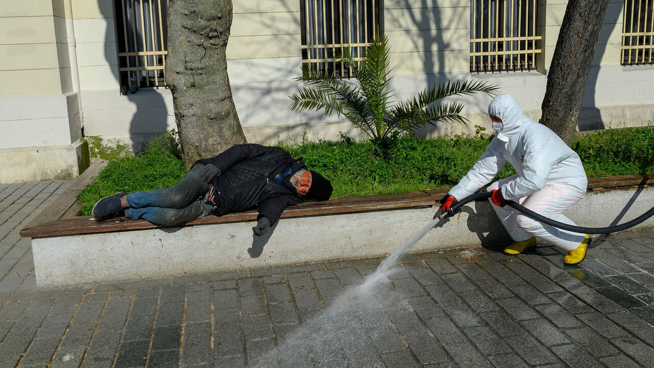 1207925275 A member of the Fatih Municipality disinfects the Sultanahmet square in Istanbul to prevent the spread of the novel coronavirus (COVID-19) on March 21, 2020. - The religious affairs authority, Diyanet, ordered the closure of around 90,000 mosques in Turkey on March 20, the day of particularly important prayers in the Muslim faith. (Photo by BULENT KILIC / AFP) (Photo by BULENT KILIC/AFP via Getty Images)